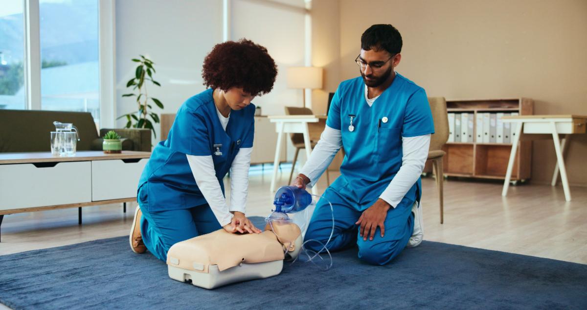Students cpr or nurses teaching with mannequin for first aid practice cardiac arrest or safety protocol. Healthcare class advice or people in medical simulation paramedic course or nursing school