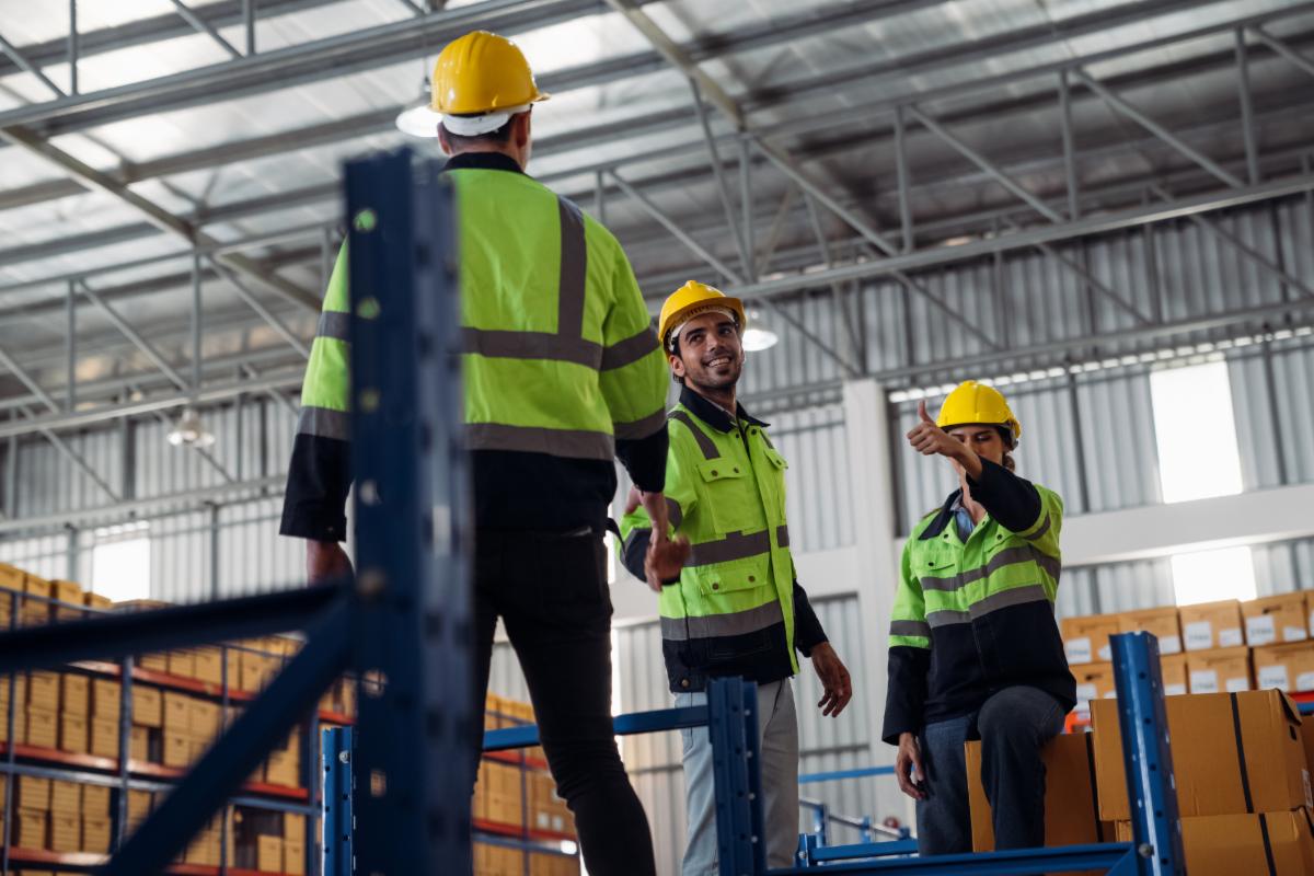 The staff is working in the office document storage area. The warehouse workers are checking the stock on the shelves in the production department.