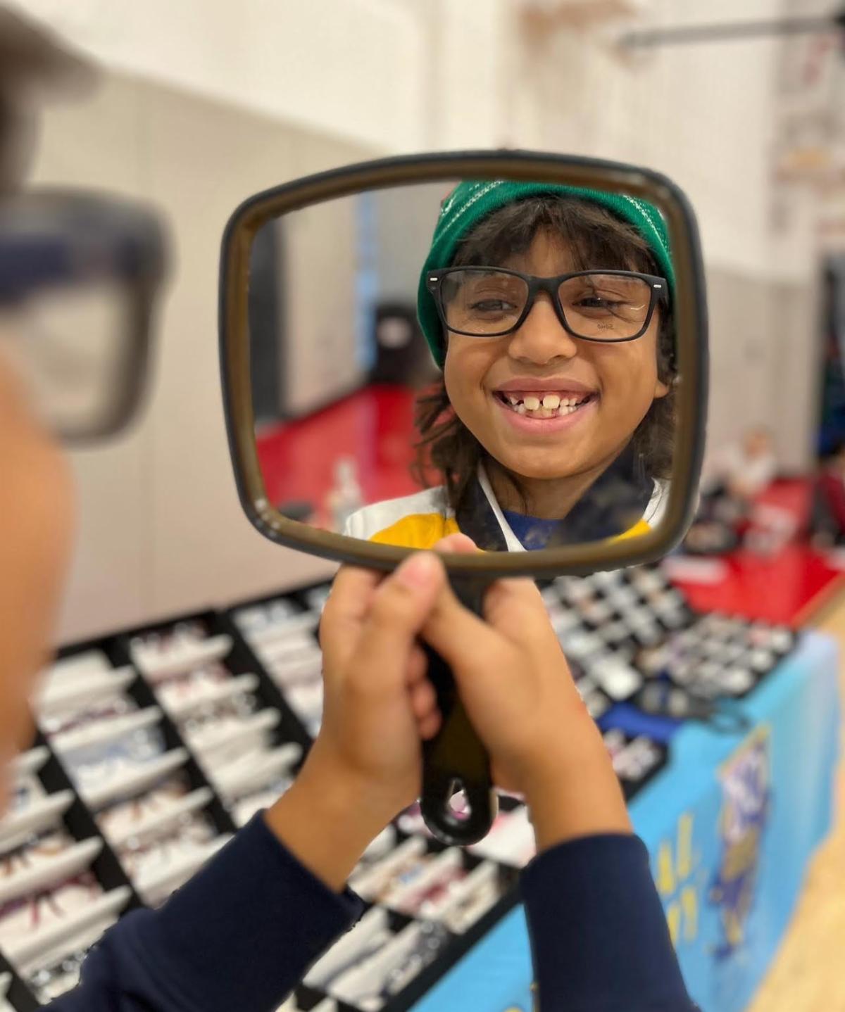 Students trying on frames