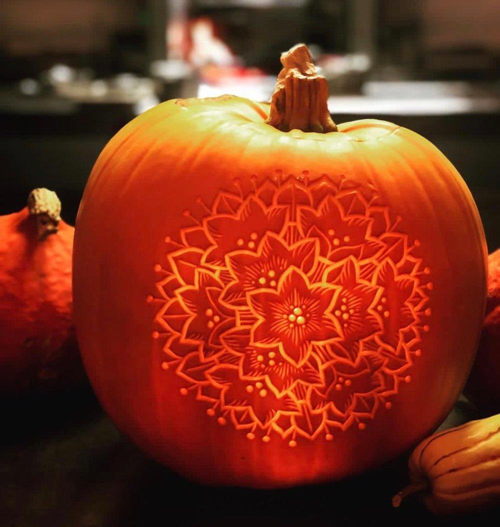 an intricately carved pumpkin