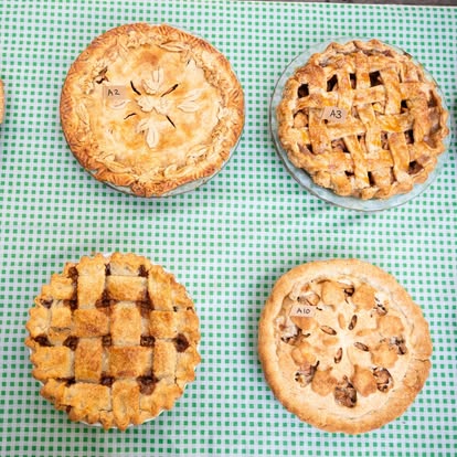 4 apples pies on a green checkered tablecloth