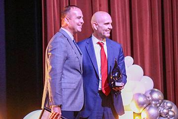 CMH CEO Michael Calhoun accepting an award