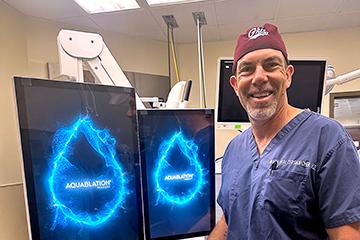 Dr. Mark Walterskirchen with two computer screens