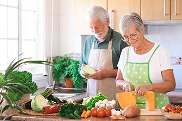 man and woman preparing fresh food