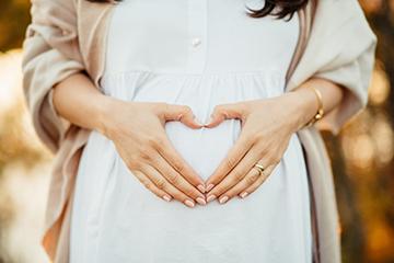 woman making heart shape with her hands