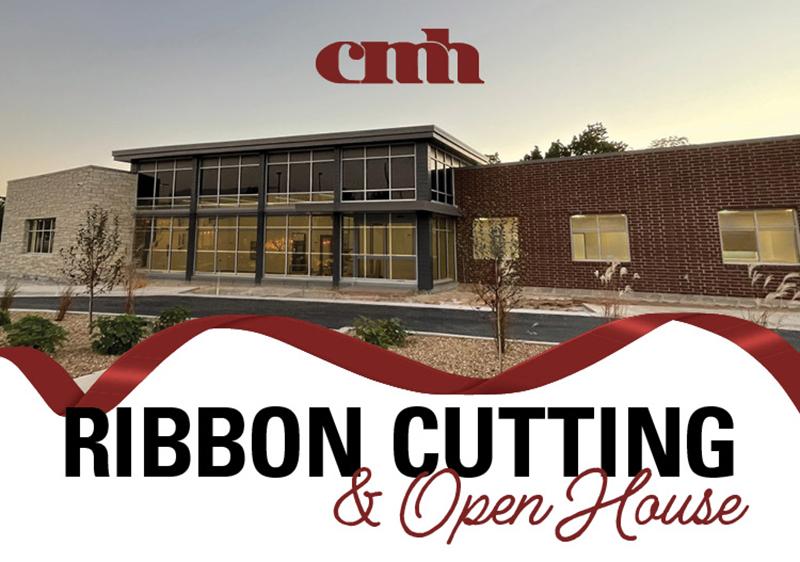 building with the text ribbon cutting and open house