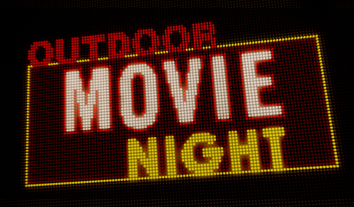 Outdoor movie night retro intro illuminated letters on big neon display with large pixels. Bright light text on bulbs display. Entertainment event advertising banner 3D illustration.