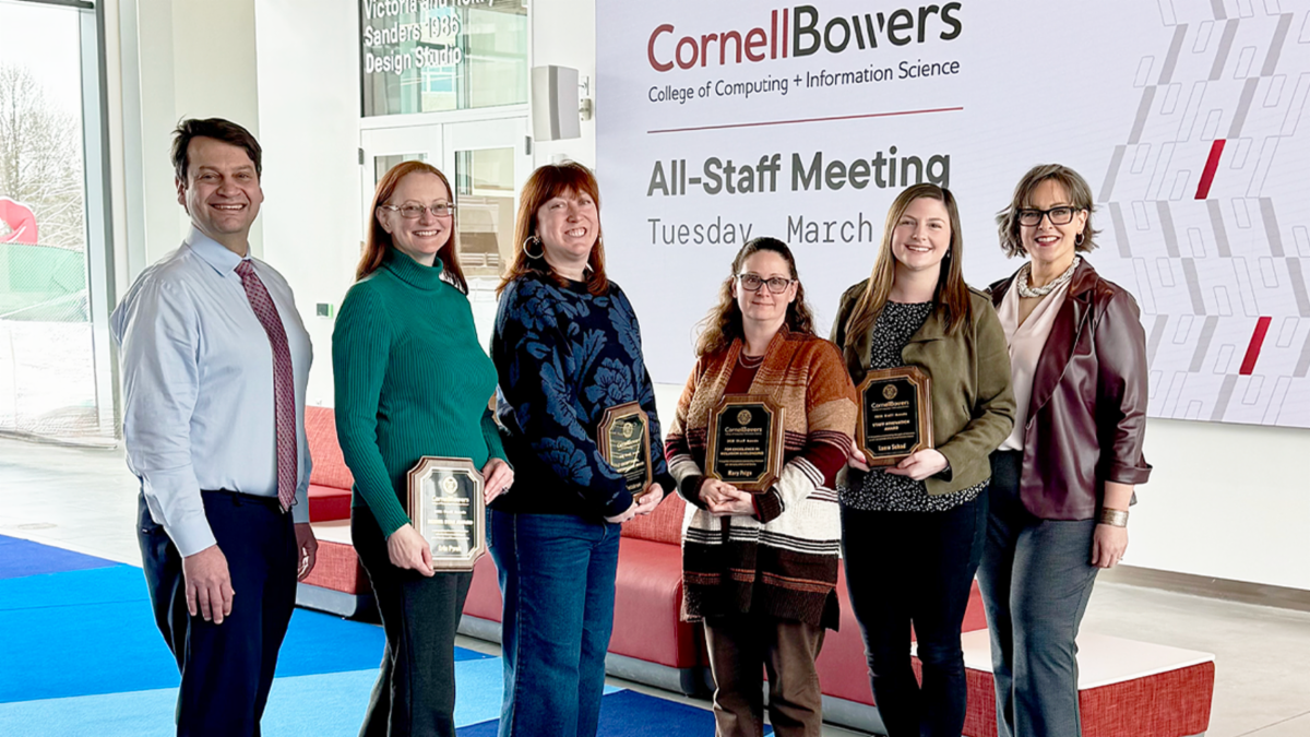 A color photo showing the staff award winners and presenters.