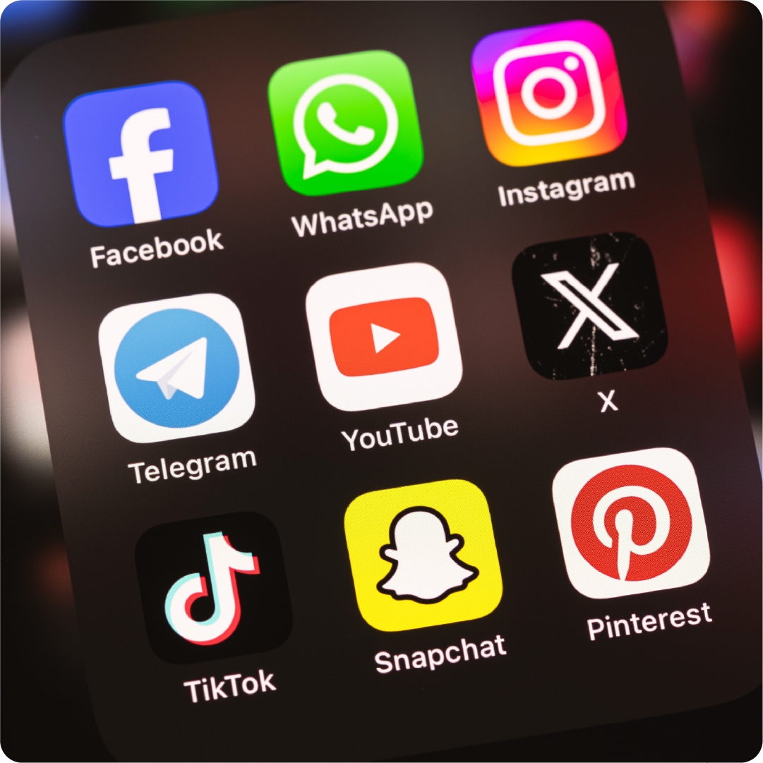 A color photo of a smart phone with social media icons. Shutterstock