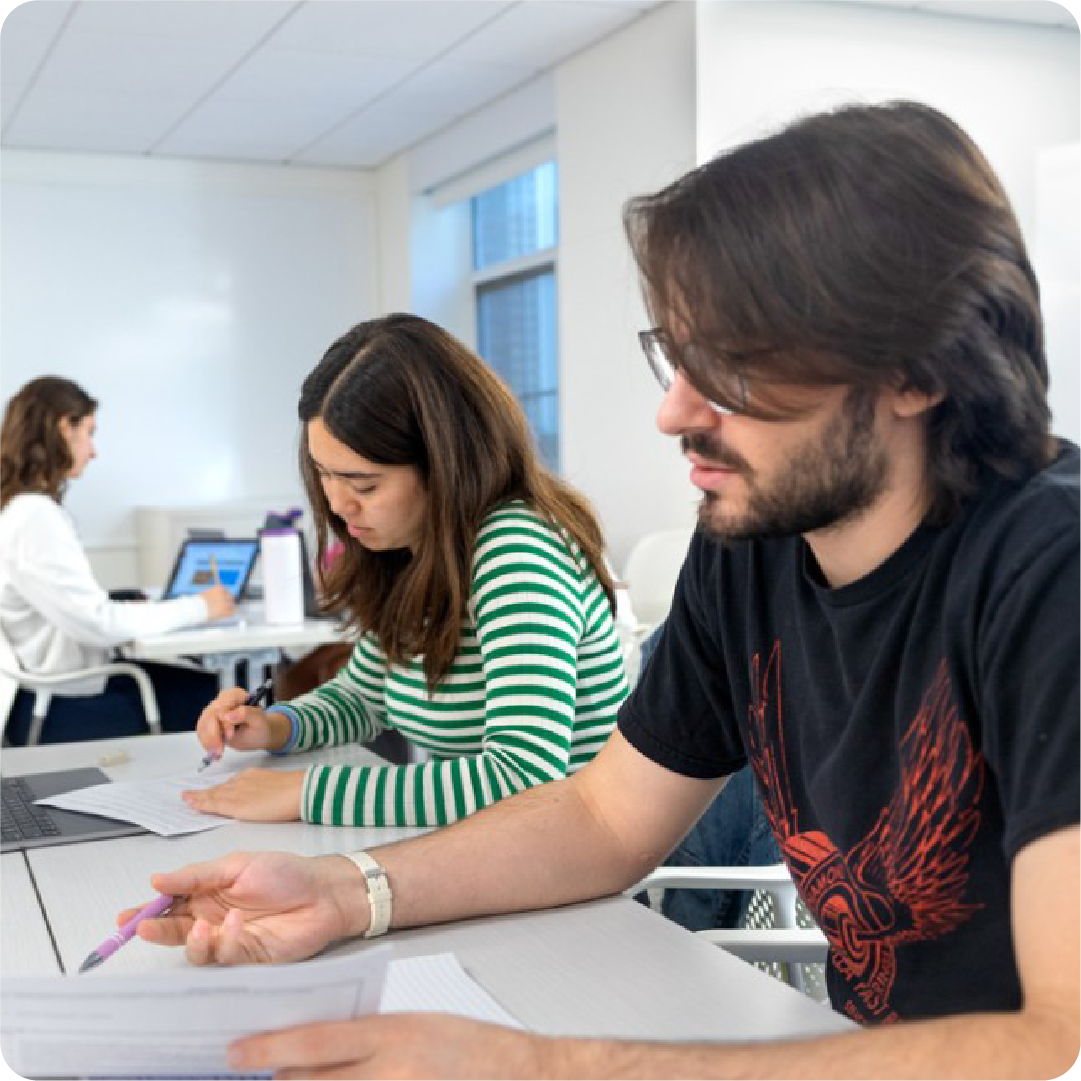 A color photo showing students working.