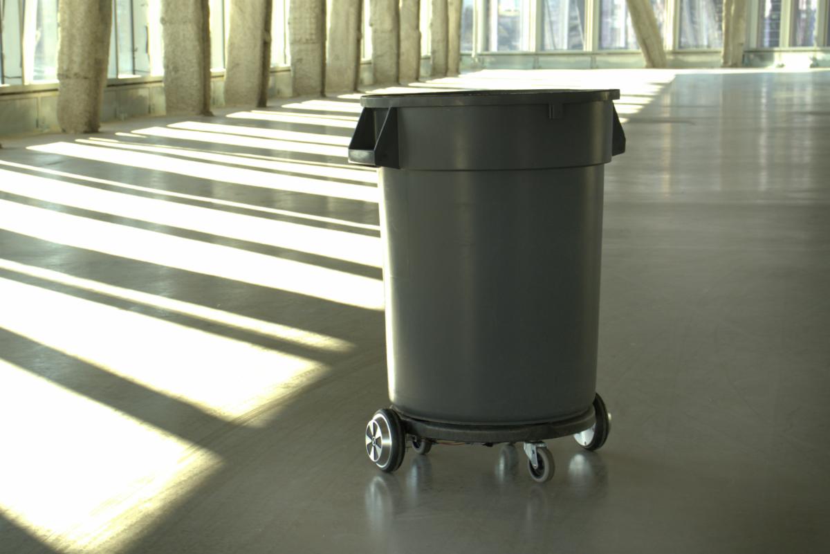 A color photo showing a trash barrel robot