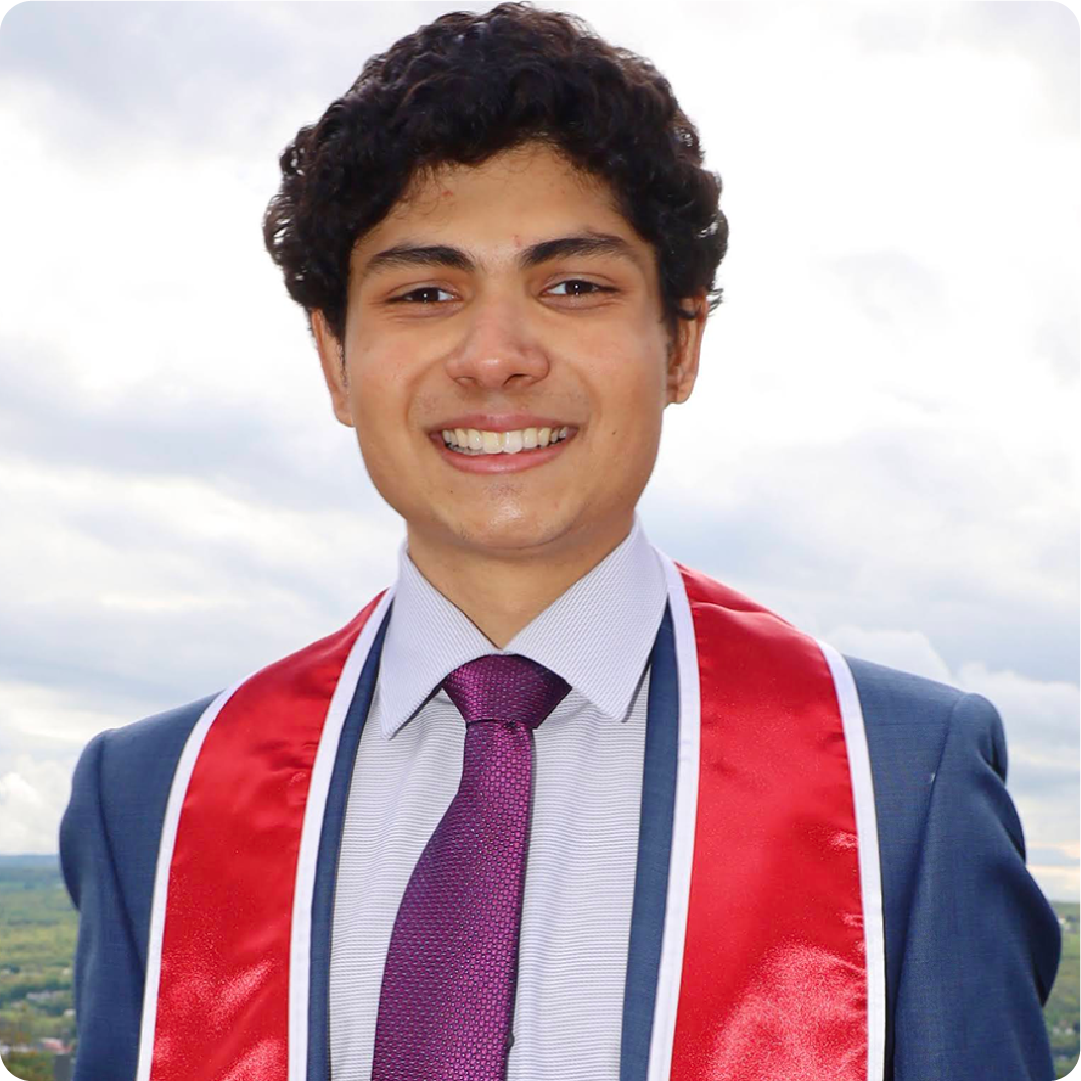A color photo of a man smiling for a photo.