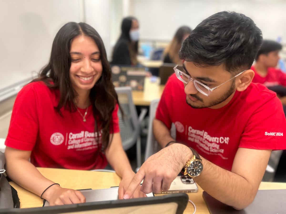A color photo showing students smiling for a photo