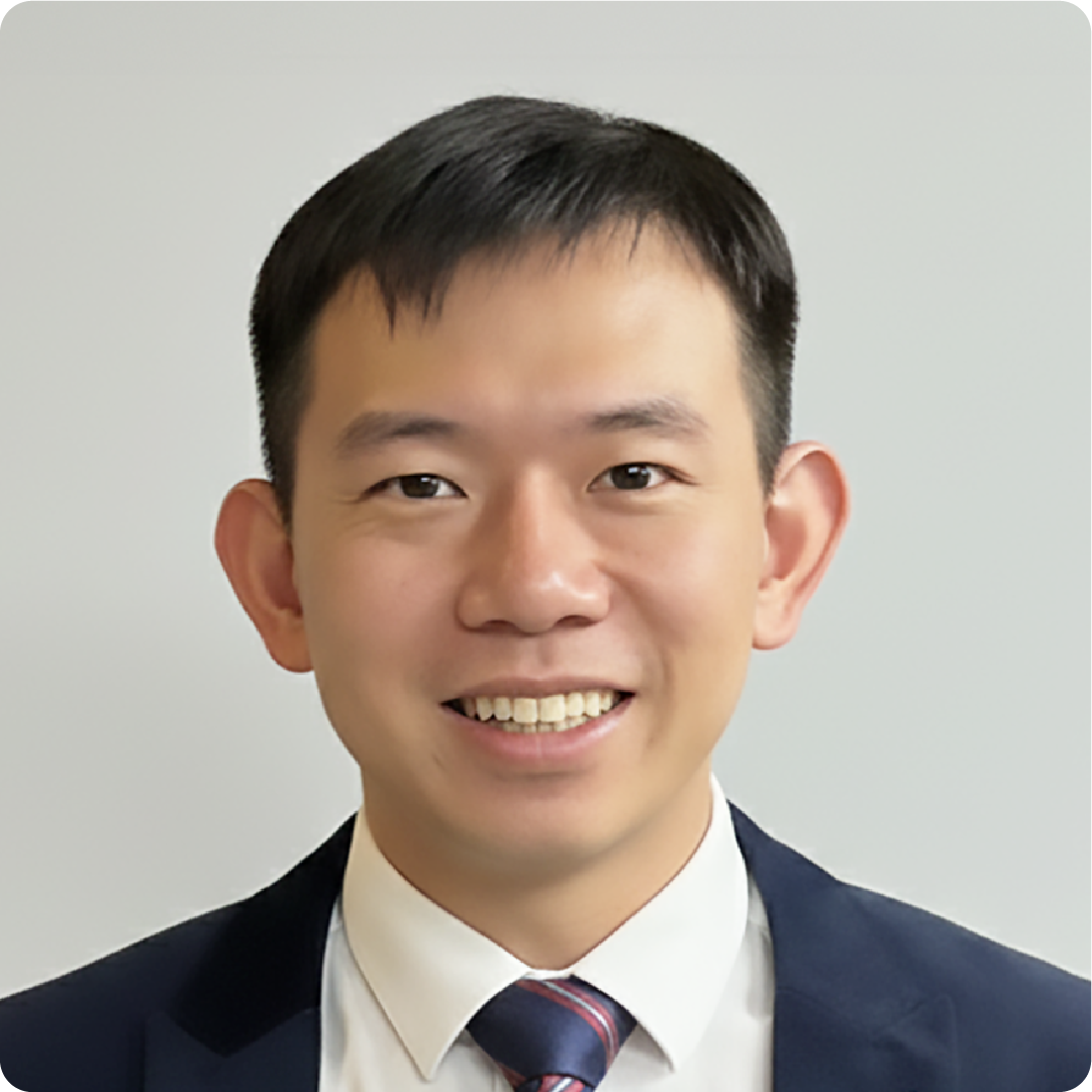 A color photo of a man smiling for a photo.