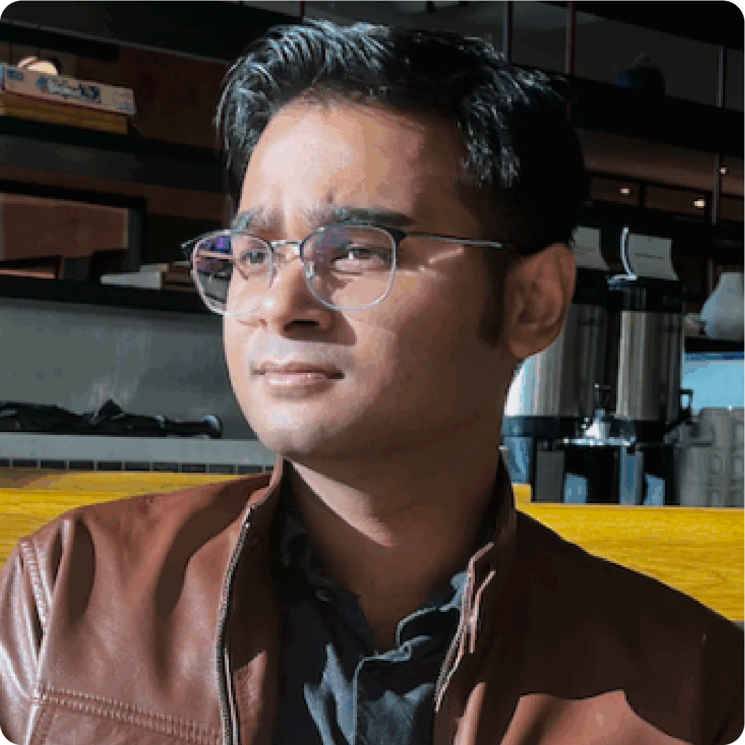 A color photo of a man smiling for a photo.