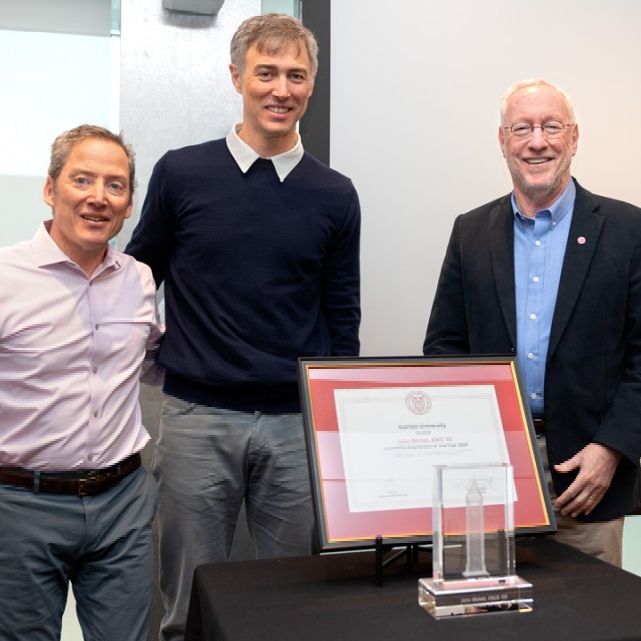 Jason Koski/Cornell University  John Bicket ’02, center, receives the Cornell Entrepreneur of the Year award from Zach Shulman ’87, J.D. ‘90, director of Entrepreneurship at Cornell, left, and Cornell President Michael Kotlikoff.