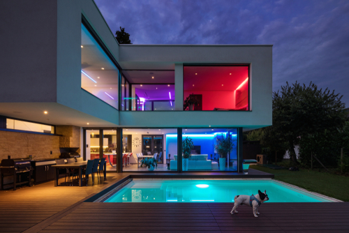Modern villa with colored led lights at night. Nobody inside