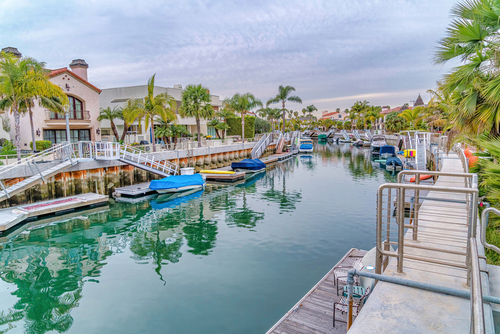 Canal amidst houses and palm trees in the scenic Long Beach CA neighborhood