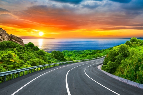 colorful nature scenery on beautiful road on the beach in summer. Stunning sea view on holiday road landscape in green mountains. highway landscape at sunset. coastal road in europe and mediterranean.