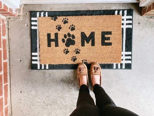 Home welcome mat with paw prints  front door