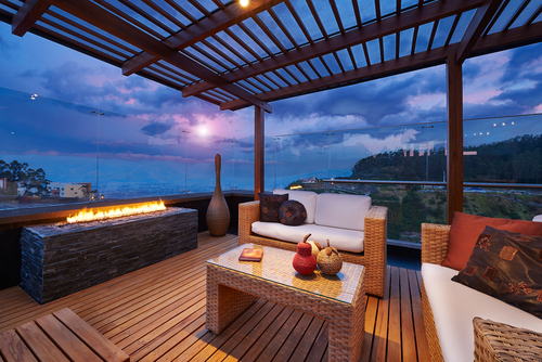 Interior design  Beautiful modern terrace lounge with pergola at sunset