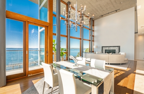Urban condo with floor to ceiling windows and ocean view
