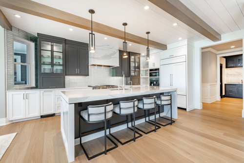 Luxurious high end kitchen with stainless appliances marble and glass tile