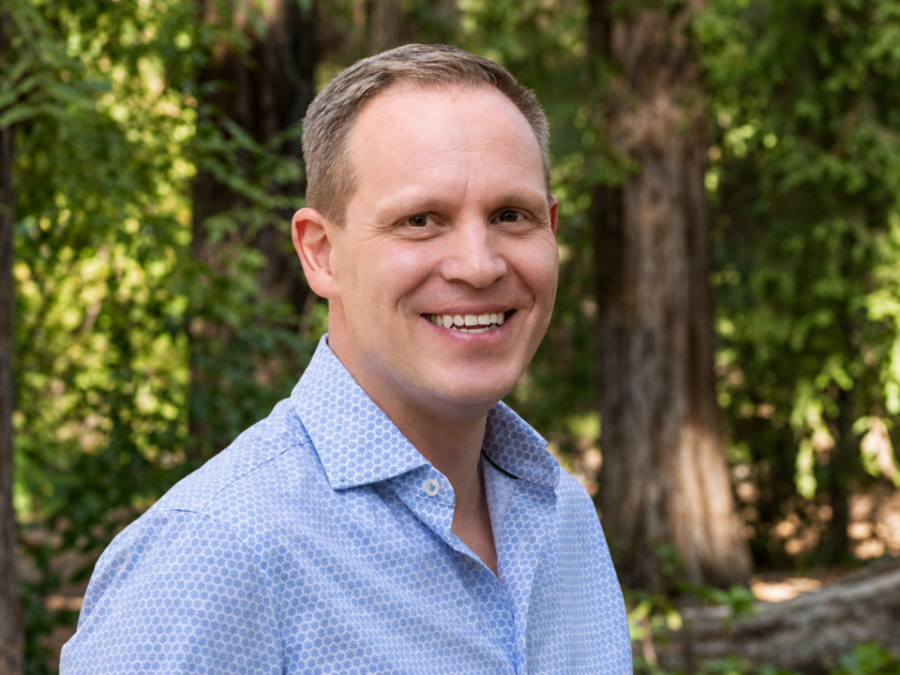 Portrait of a man in light blue shirt outside