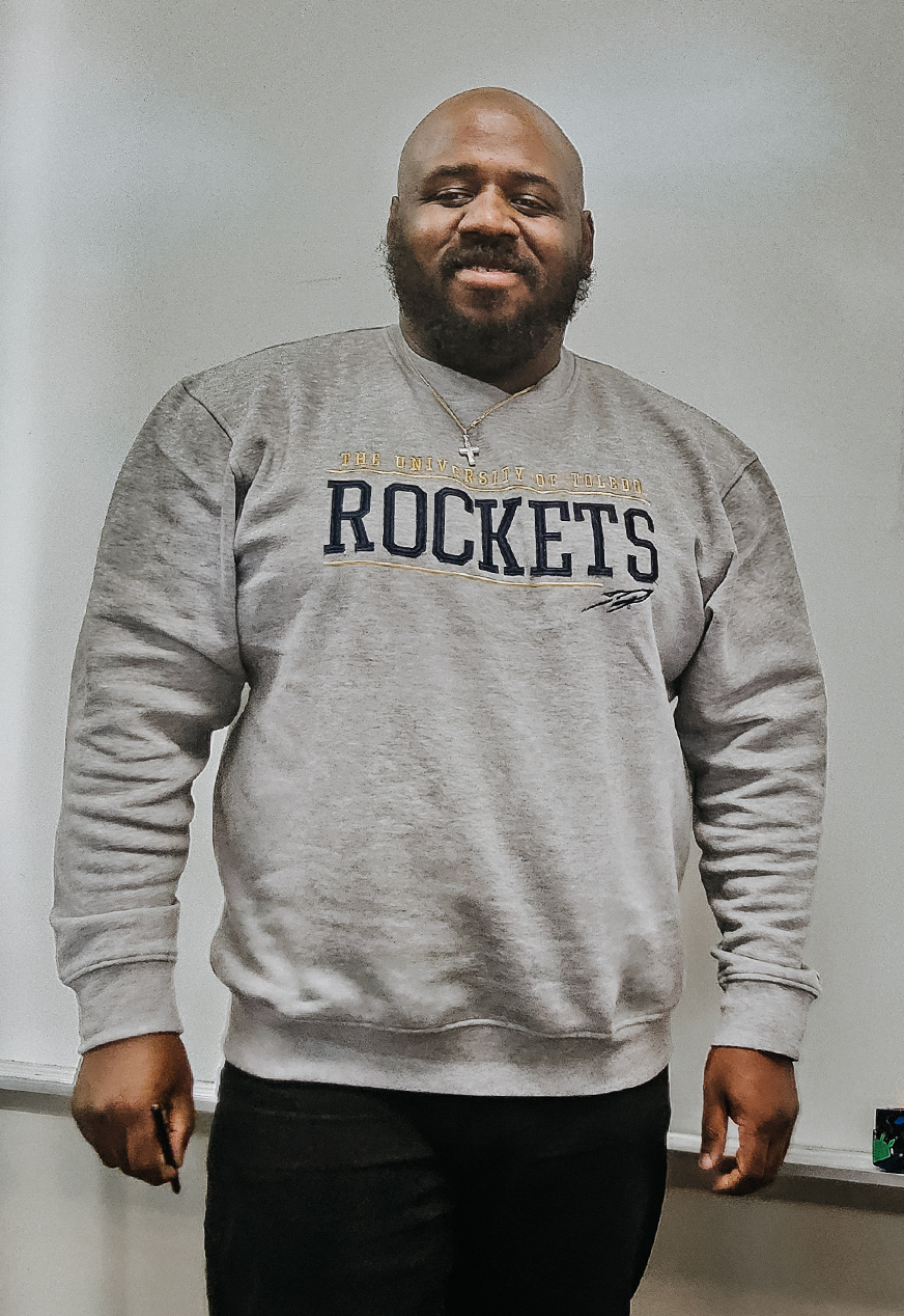 Trey Lampkin education graduate from UToledo wearing a Rockets sweatshirt