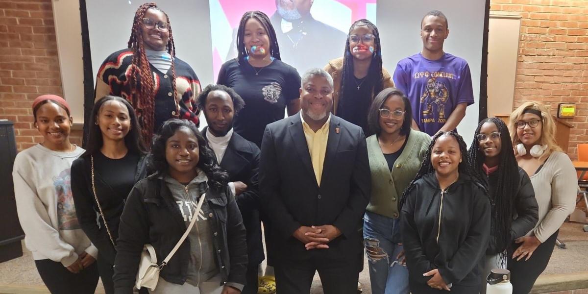 large group of students and a guest speaker