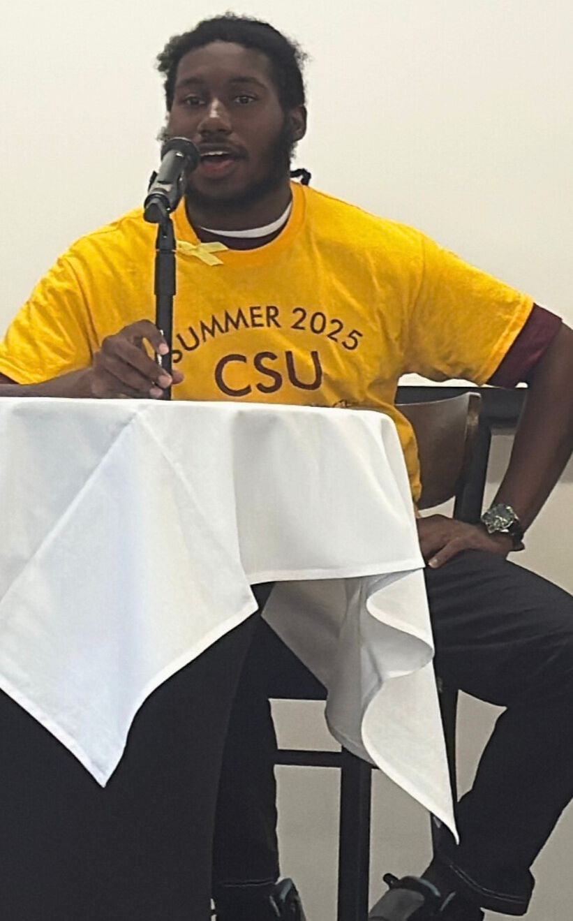 lamont calhoun speaks into a microphone as a panelist at the suicide prevention in the black community summit sponsored by the ohio suicide prevention foundation