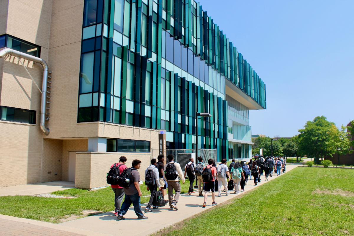 intel summer internship participants walking past a building at wright state university