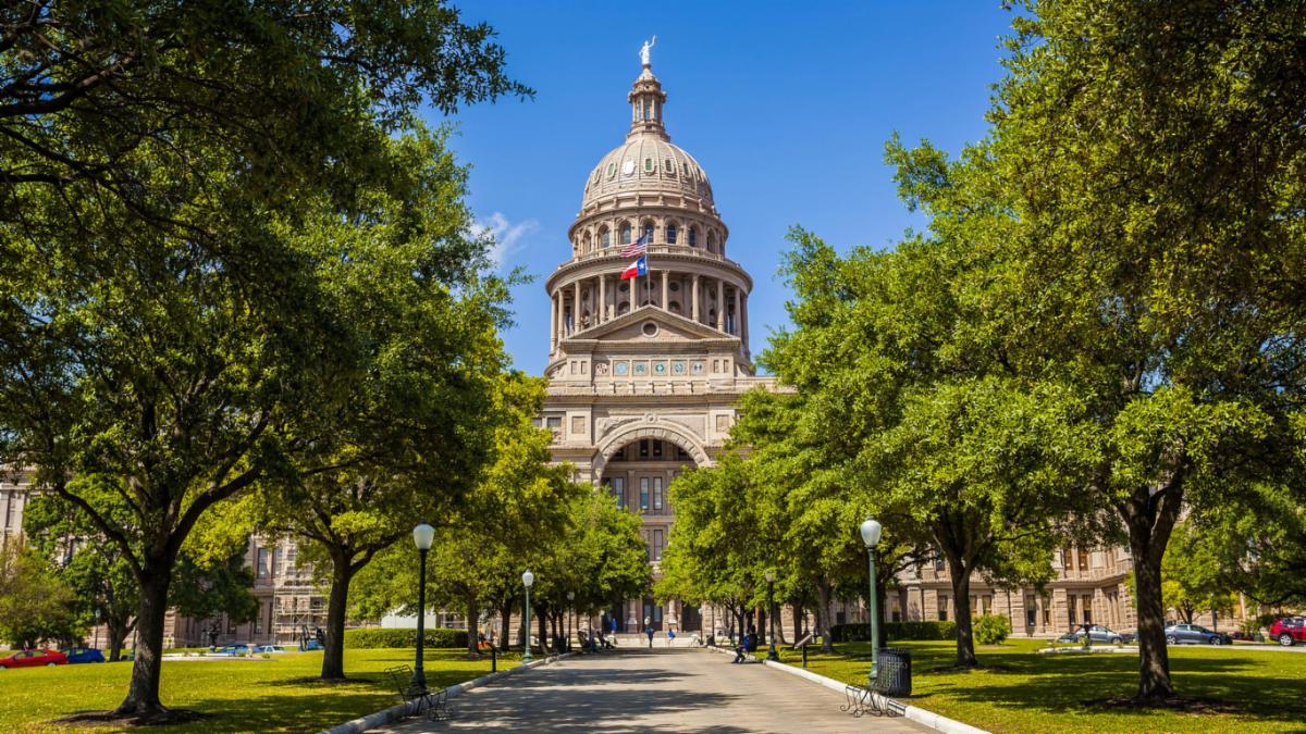 The State Capitol building under a blue sky in Austin.