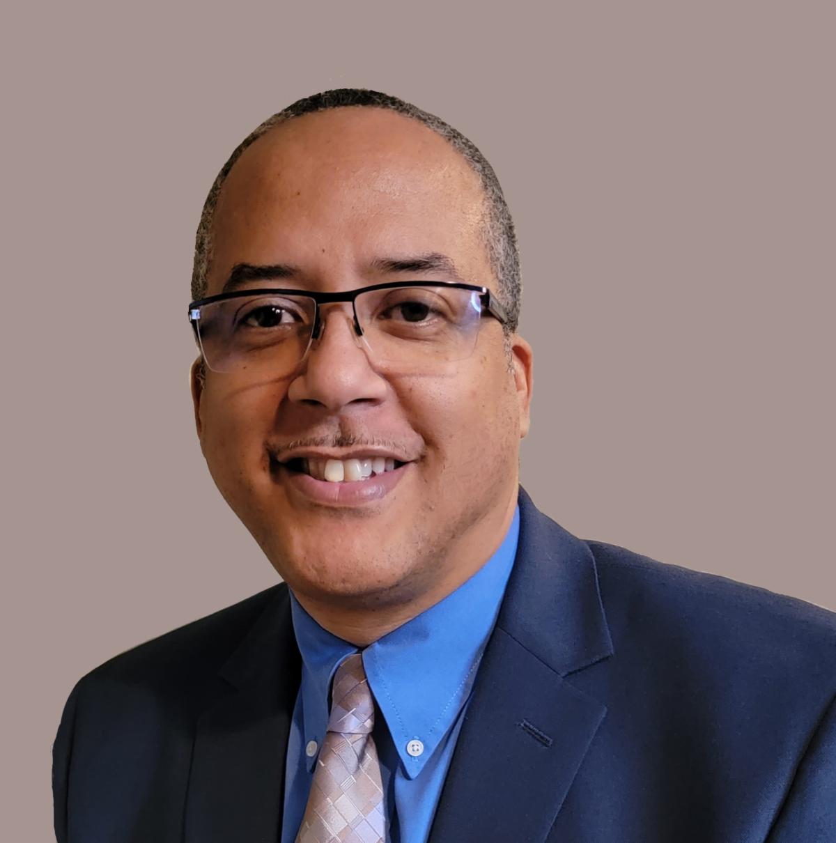 Sean Jackson, a black male, smiling at the camera.