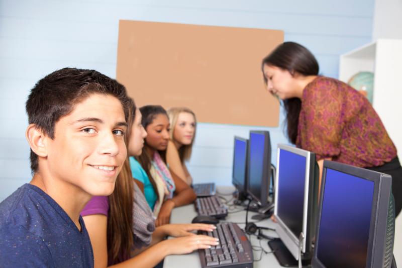 teen boy in computer class