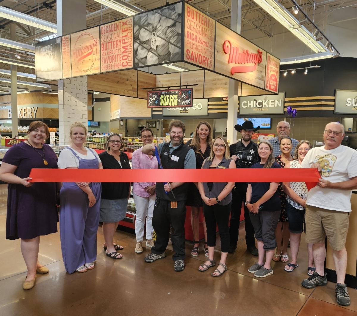 People attending a ribbon cutting at King Soopers.