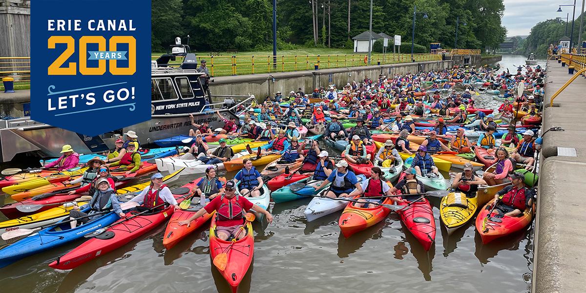 Hundreds of colorful kayaks raft together while in Lock 6 of the Erie Canal.