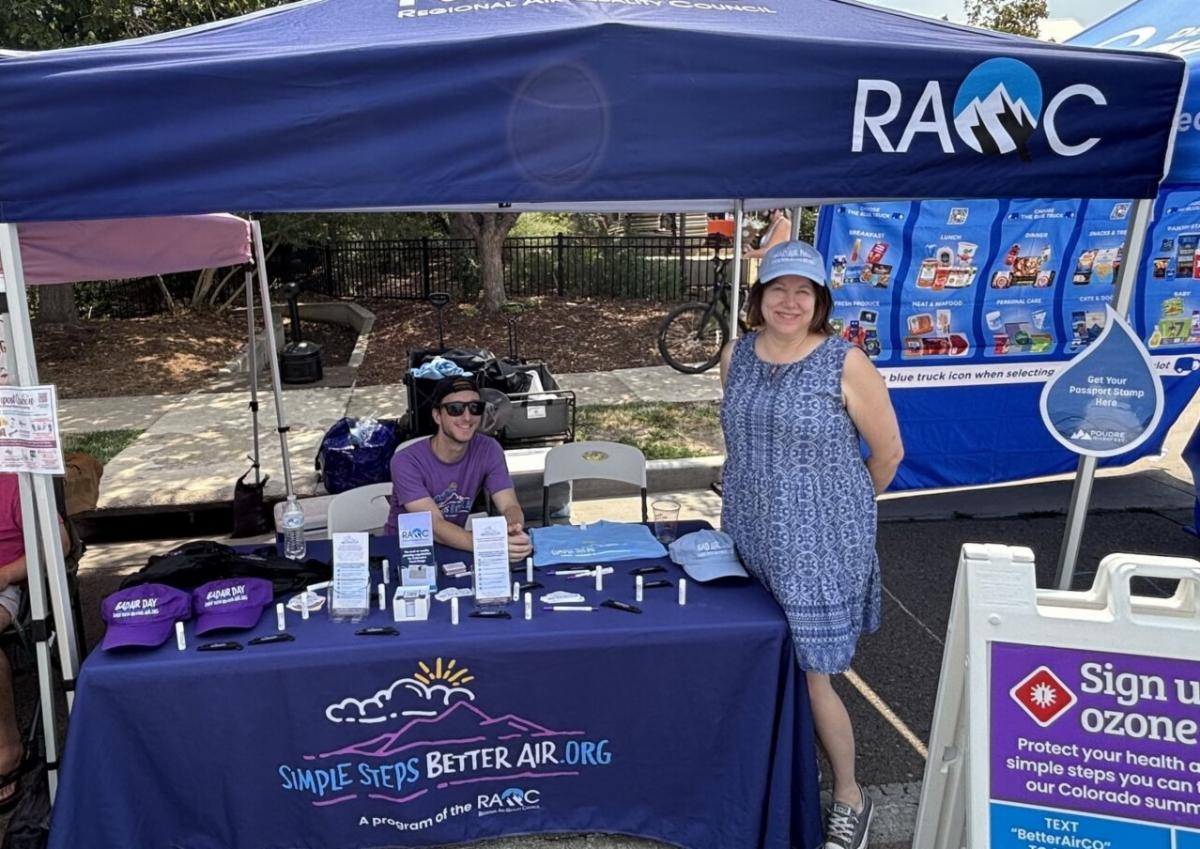 People at booth outdoors at festival