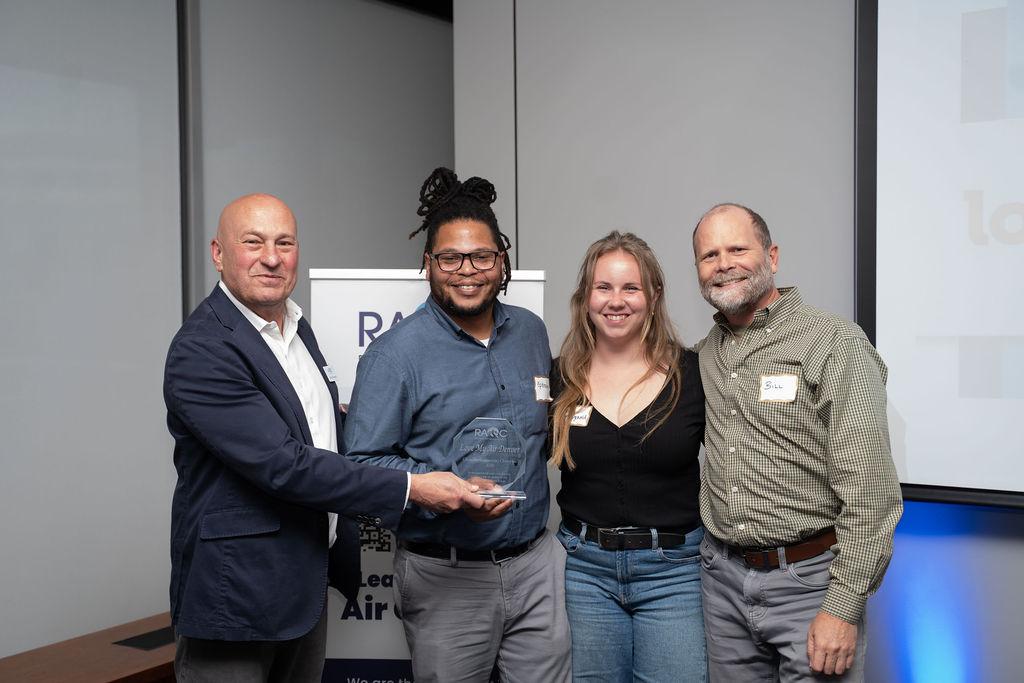 People smile as receiving award
