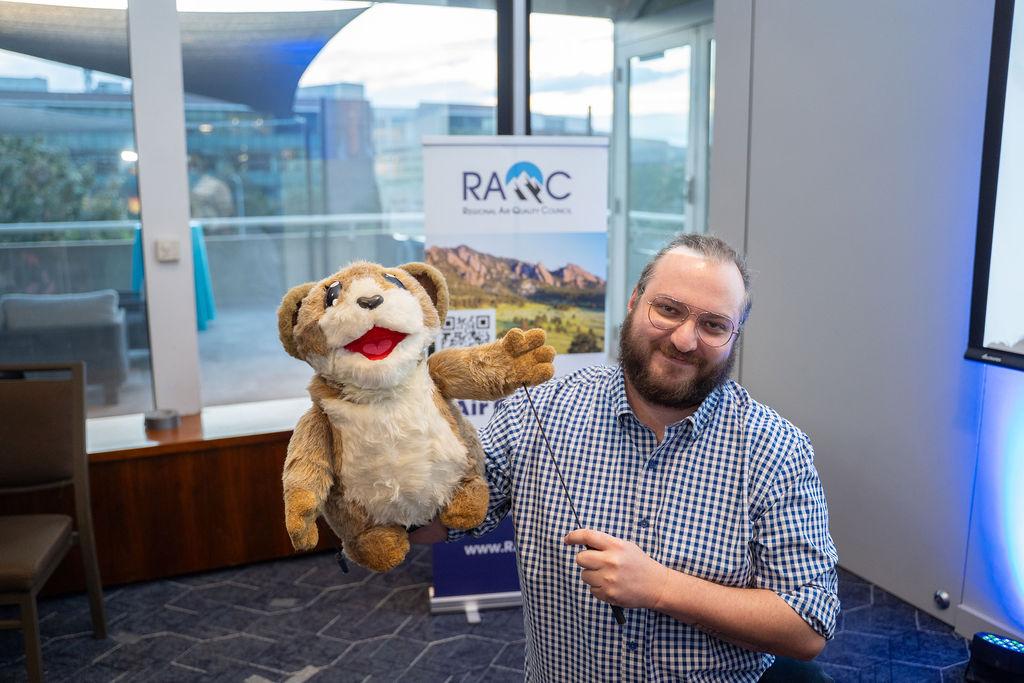 Pika puppet and human handler pose