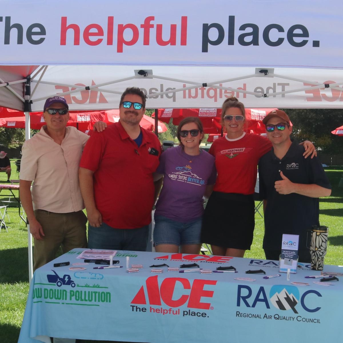 People stand at ACE Hardware table