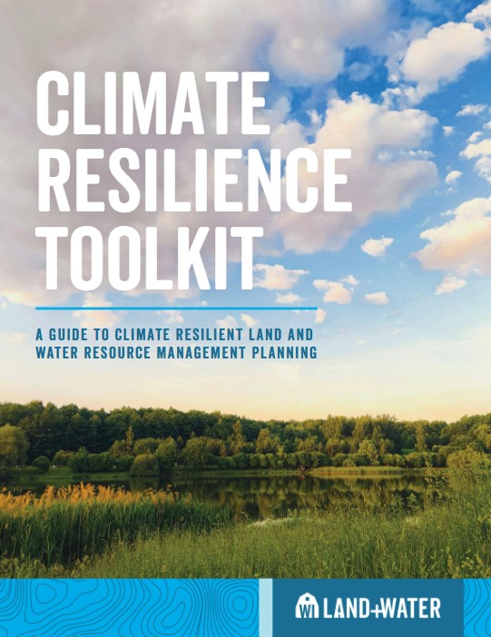 Puffy clouds float above a wetland on the cover of the Climate Resilience Toolkit.