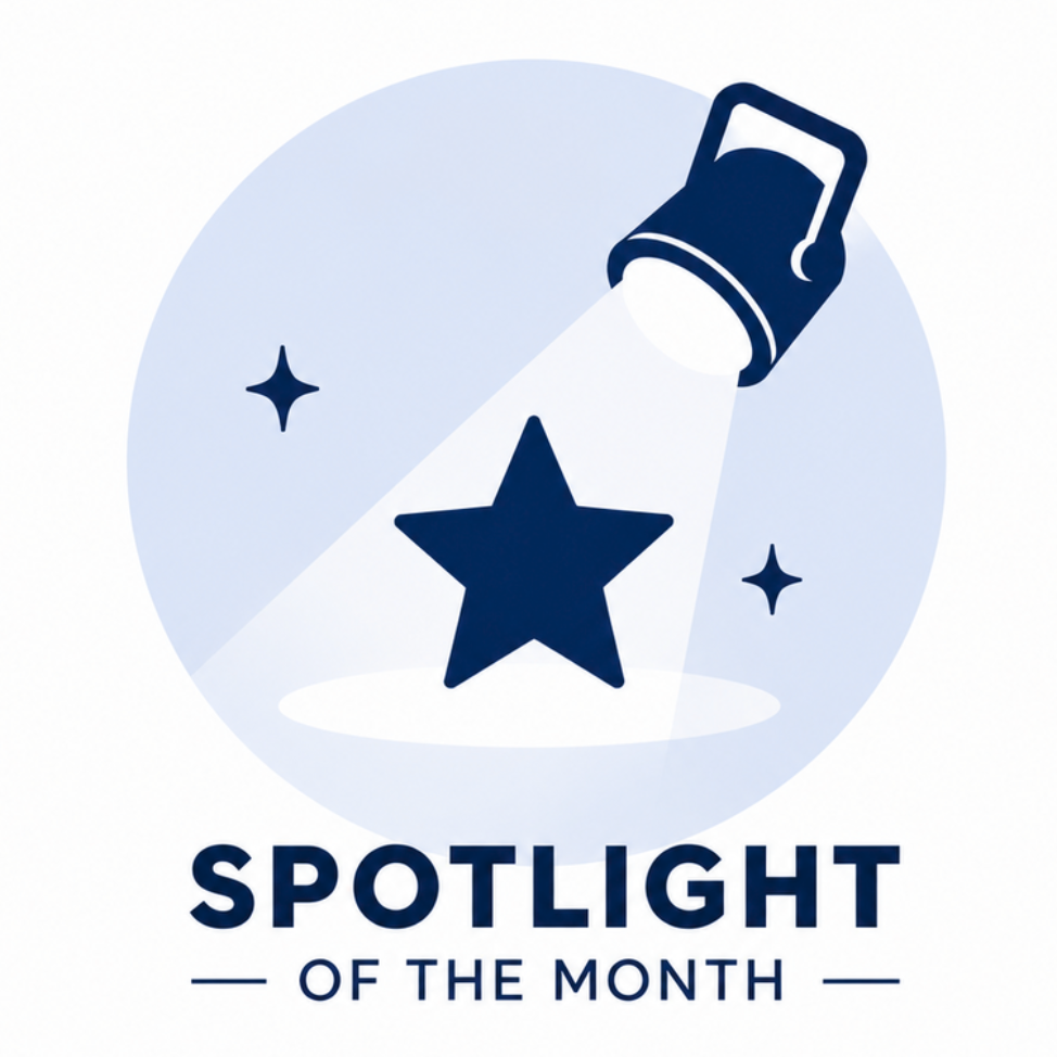 Spotlight of the Month graphic with a spotlight shining on a blue star icon.