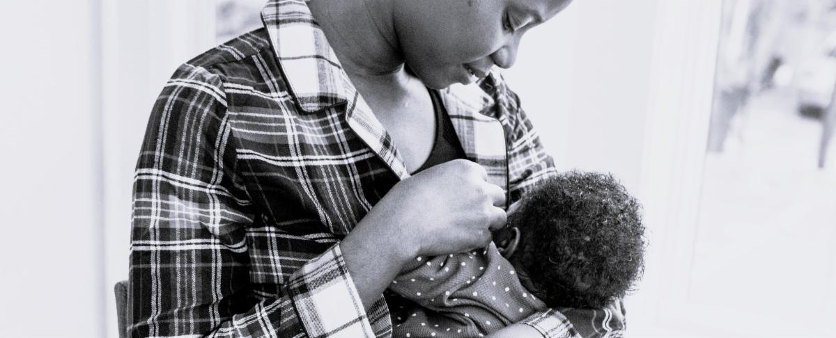 Photo of a woman holding a baby.