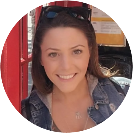 Photo of Rickie Wolfinsohn. She is smiling with brown hair.