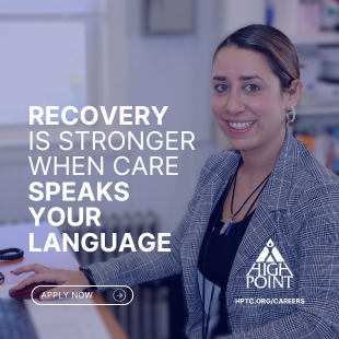 The words recovery is stronger when care speaks your language apply now over the image of a women sitting at a desk and smiling in front of a keyboard