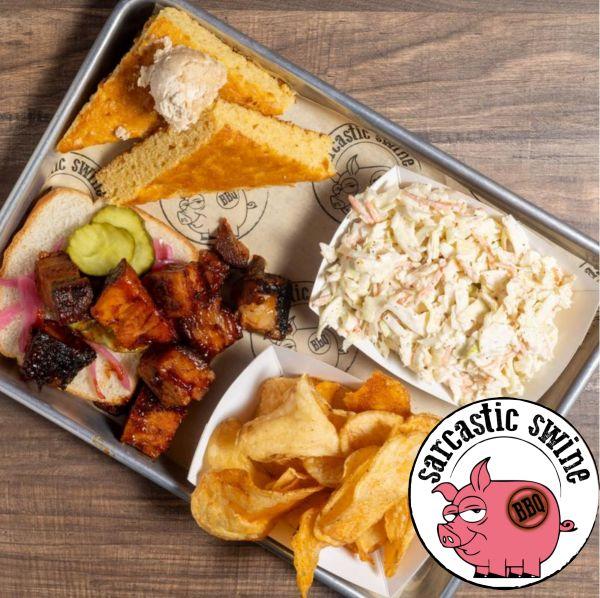 Image of Pork Belly Burnt Ends pickles pickled onions cornbread chips coleslaw