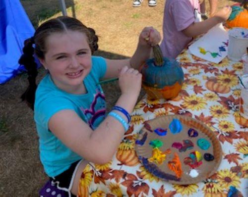 Pumpkin Painting Table at the Fall Harvest Festival