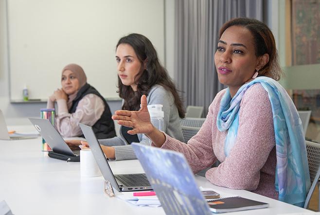 PhD students in class Bashir and Global Scholars Naderi and Adam