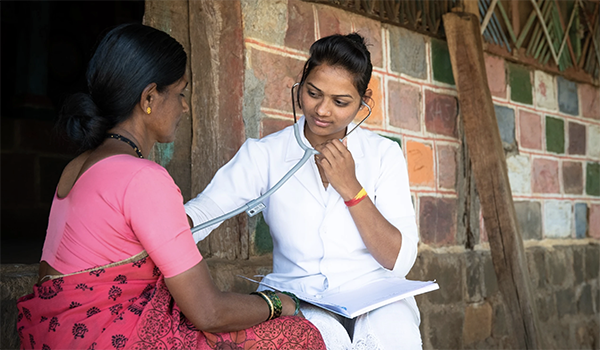 A trained nurse screening a community member for signs of tuberculosis.